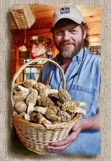 Anthony Williams holding a basket of morel mushrooms