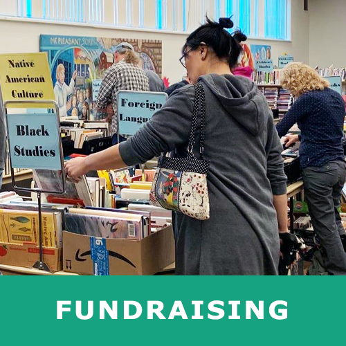 Image of woman browsing books at book sale