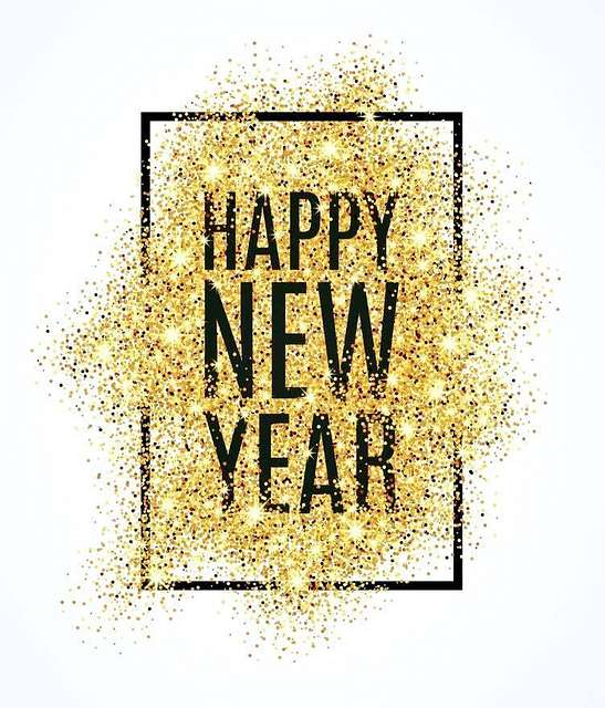 Image of sign saying "Happy New Year" on gold glitter.