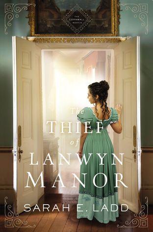 the Thief of Lanwyn Manor by Sarah E. Ladd book cover. Young woman in green 19th century dressing standing in doorway.