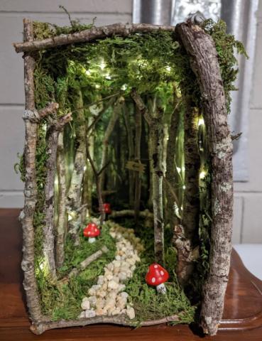 Image of a forest with path and mushrooms book nook.