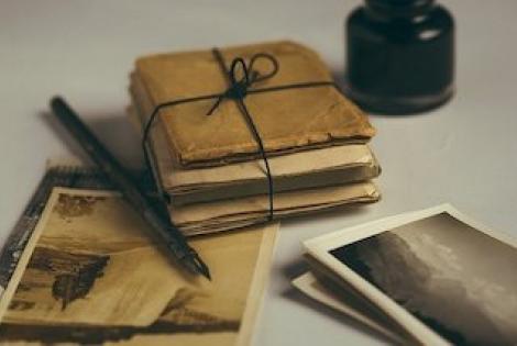 Old letters and photographs with fountain pen.