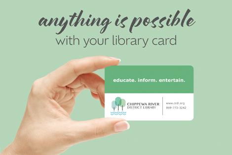 Image of hand holding library card, "Anything is possible with your library card"